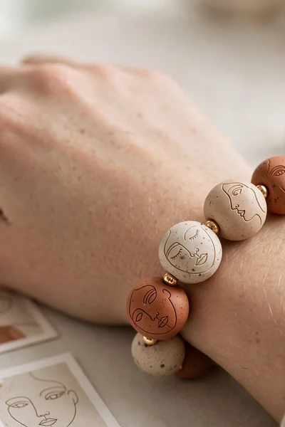 Abstract face bead clay bracelet