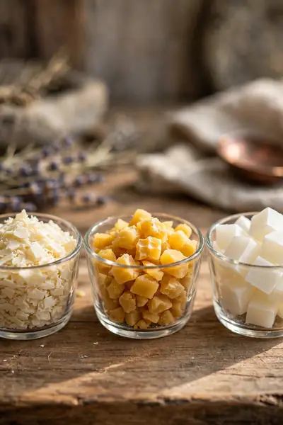 Soy wax flakes, beeswax and paraffin compared side by side