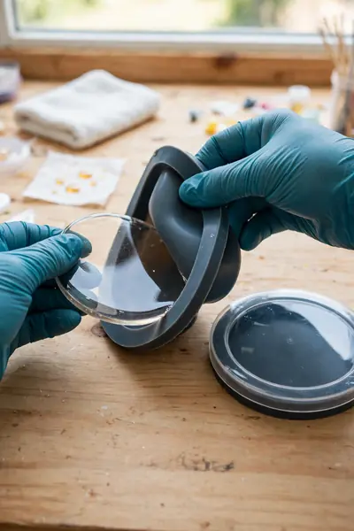 demolding a cured resin coaster from silicone