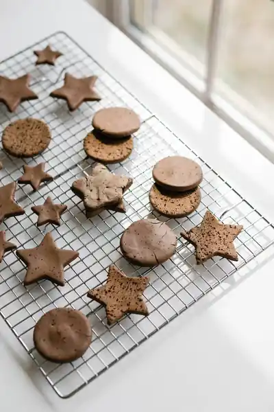 Coffee clay ornaments drying on wire rack
