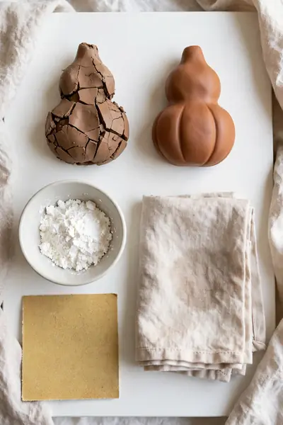 Comparing cracked and perfect clay ornaments