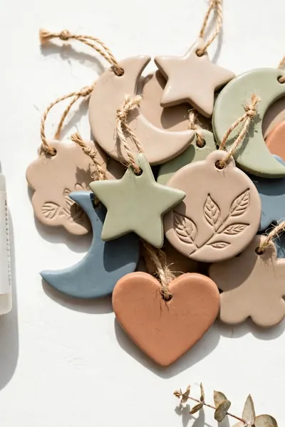 Sealer bottle with finished clay ornaments